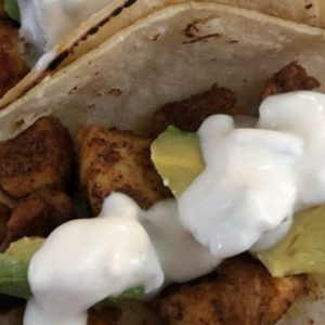 SPICY CHICKEN AND AVOCADO TACOS WITH CREAMY CILANTRO LIME SAUCE