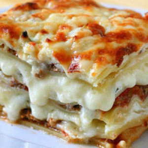 Delicious lasagna with minced meat and mushrooms in bechamel sauce. If you don’t love lasagna – you just haven’t prepared it right!