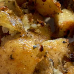 ROASTED GARLIC BUTTER PARMESAN POTATOES