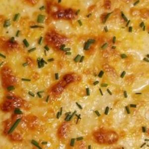 CHEESY AND CREAMY DELMONICO POTATOES: THE PERFECT COMFORT FOOD FOR ANY OCCASION
