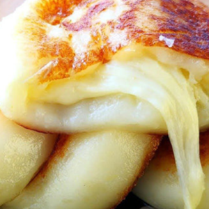 Potato cakes filled with melted cheese