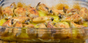 Baked chicken wings with potatoes: the tasty meal